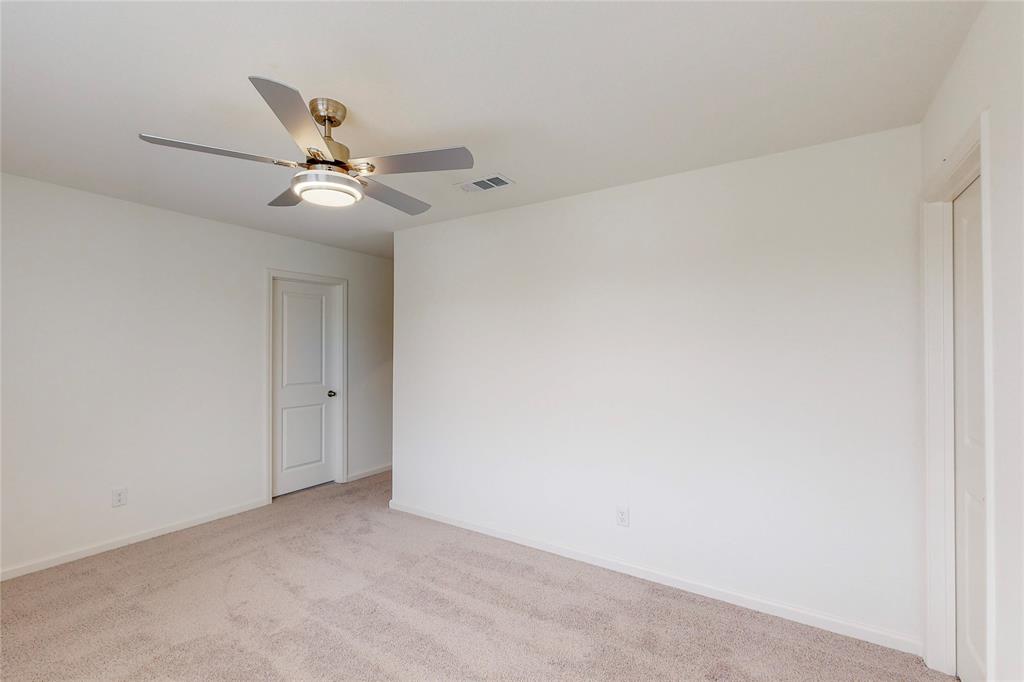 417 Madison Way Princeton, TX 75407 - Photo 29 of 40 Carpeted empty room with baseboards and a ceiling fan