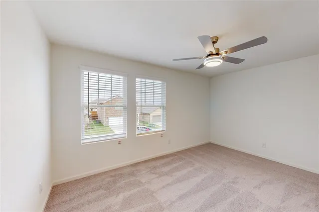 a view of a ceiling fan in a room
