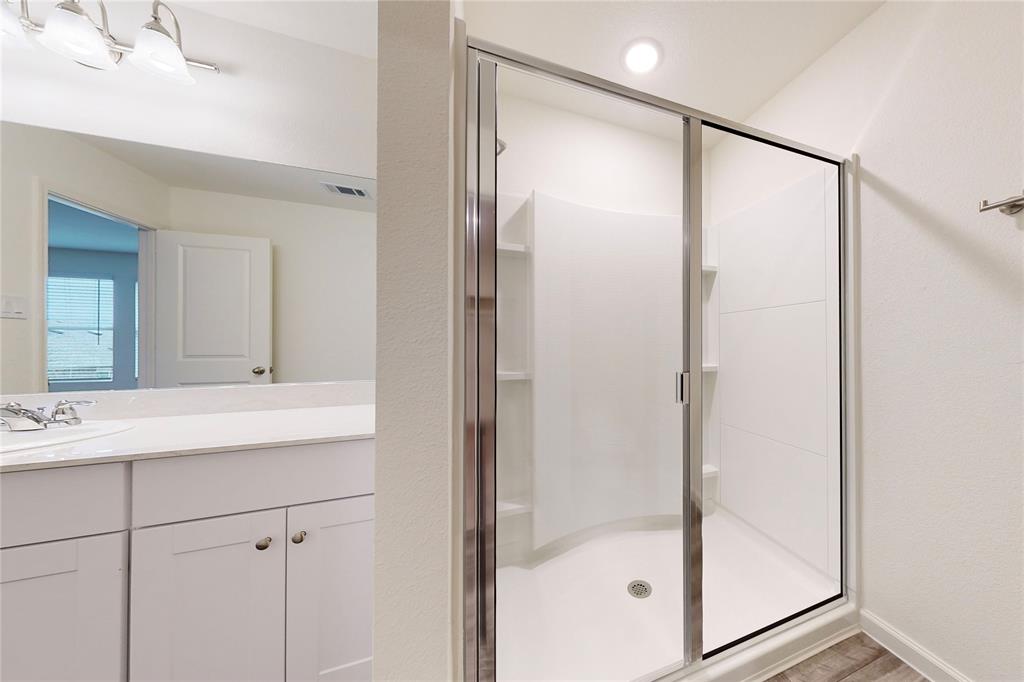417 Madison Way Princeton, TX 75407 - Photo 33 of 40 Full bath featuring a shower stall and vanity