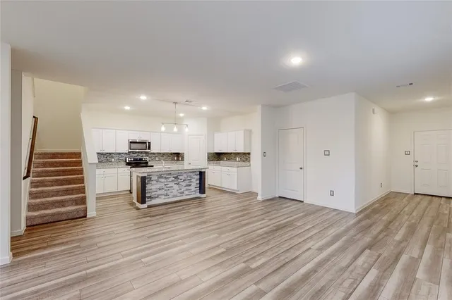 a view of a field with wooden fence