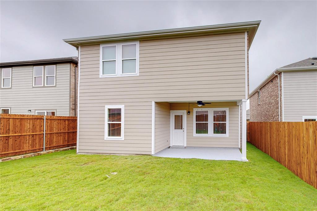 417 Madison Way Princeton, TX 75407 - Photo 9 of 40 Back of property with ceiling fan, a patio area, and a fenced backyard