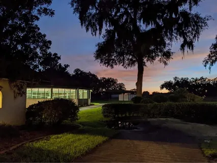 a view of a backyard of the house