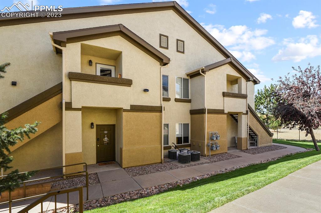 3960 Riviera Grove, Unit 204 Colorado Springs, CO 80922 - Photo 2 of 25 a view of outdoor space yard and deck