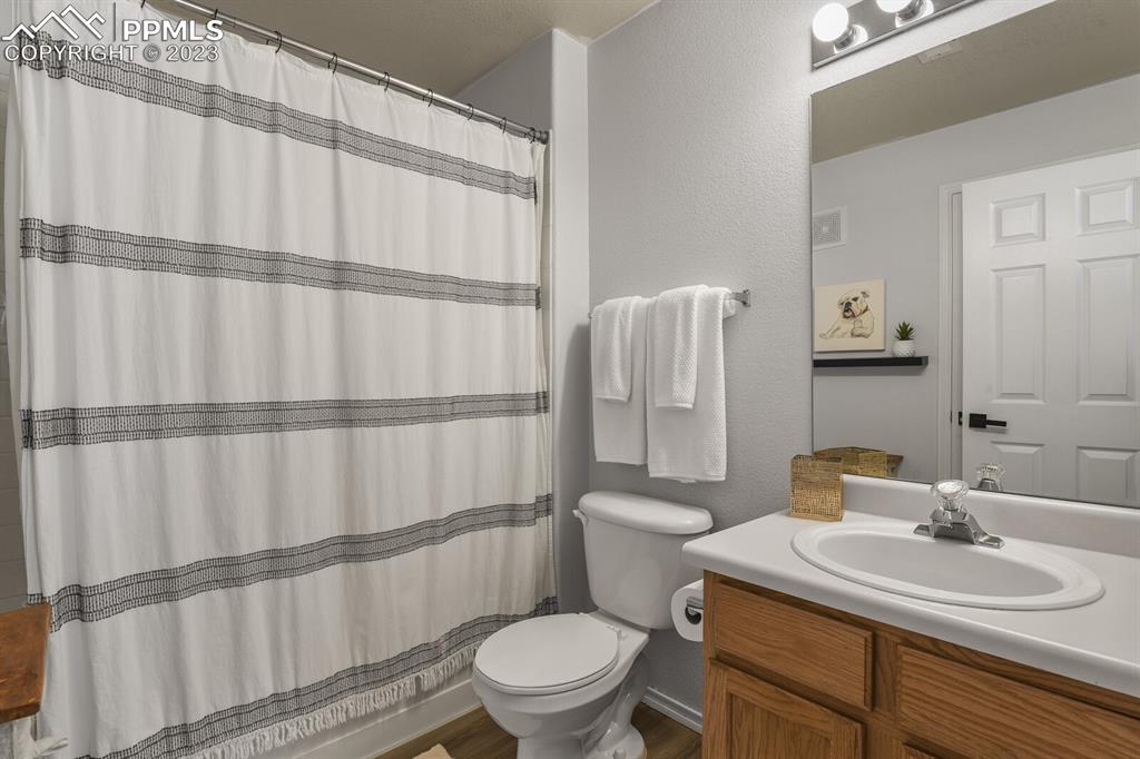 3960 Riviera Grove, Unit 204 Colorado Springs, CO 80922 - Photo 21 of 25 a bathroom with a sink a toilet and shower
