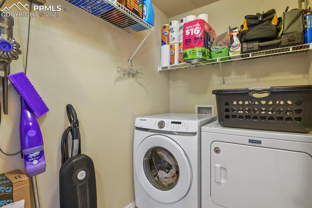 3960 Riviera Grove, Unit 204 Colorado Springs, CO 80922 - Photo 23 of 25 a utility room with dryer and washer