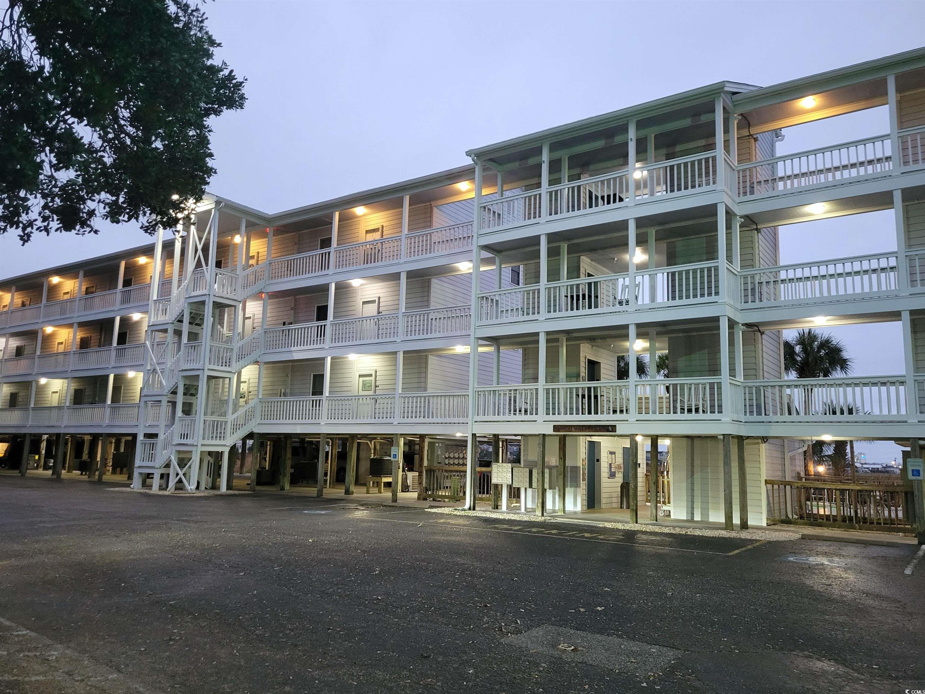 310 Marsh Place, Unit 312 Murrells Inlet, SC 29576 - Photo 1 of 40 View of outdoor building at dusk