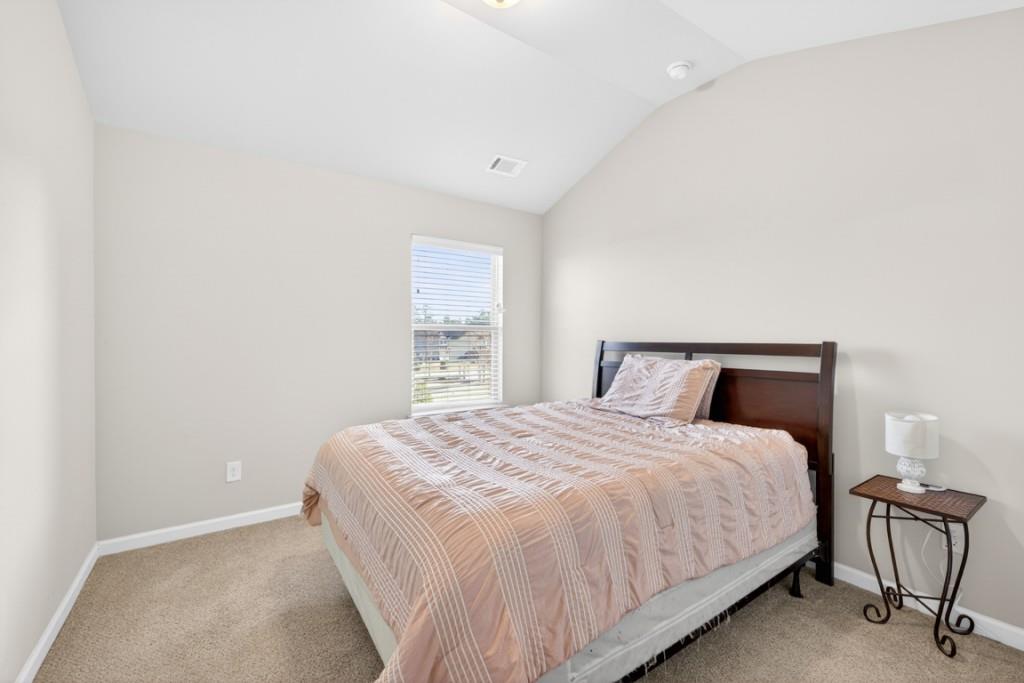 3652 Prospect Point Drive Oakwood, GA 30566 - Photo 12 of 20 a large bed sitting in a bedroom next to a window