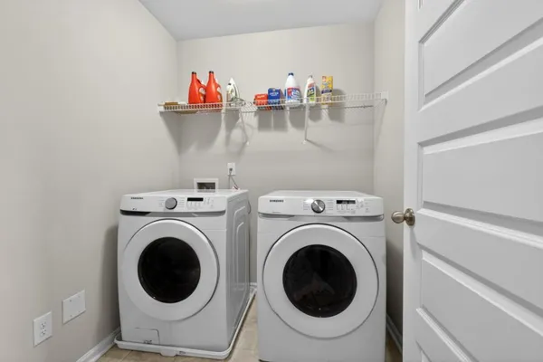 a utility room with dryer and washer