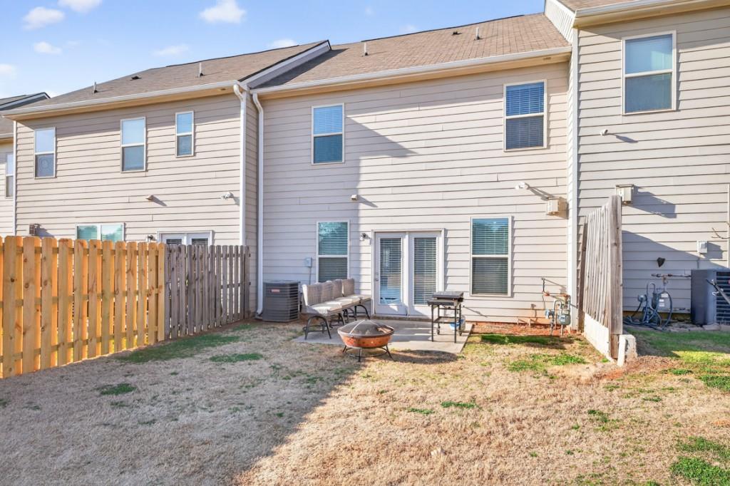 3652 Prospect Point Drive Oakwood, GA 30566 - Photo 18 of 20 a view of a house with backyard and sitting area