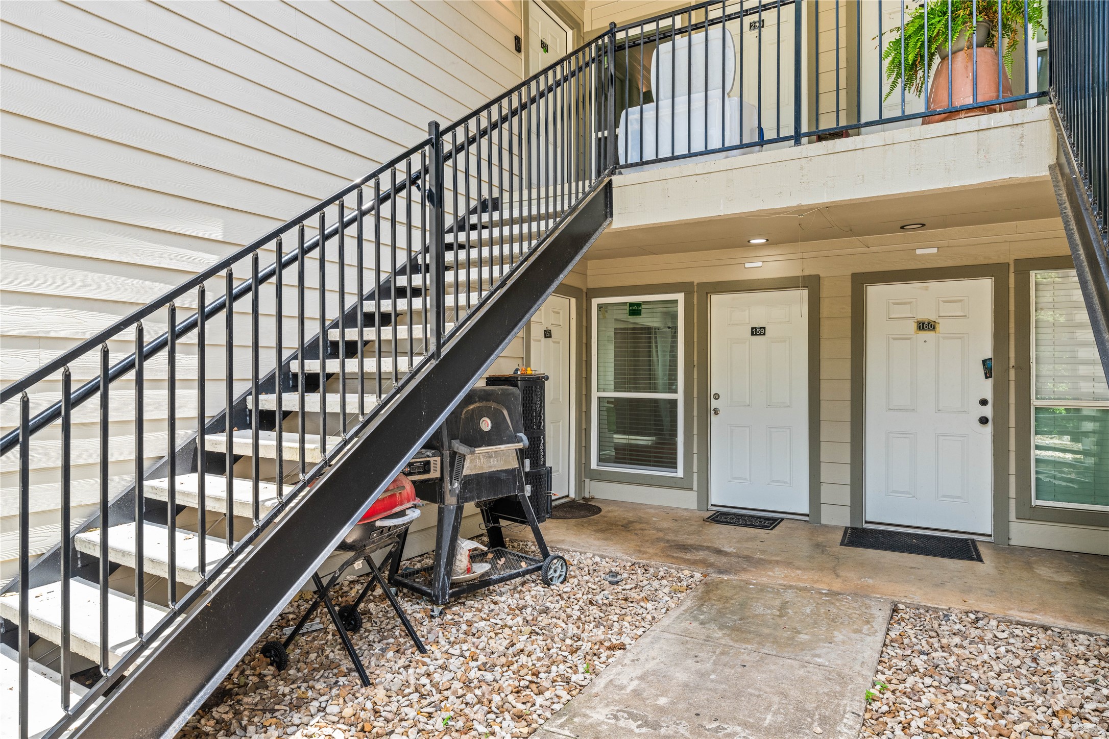 2124 Burton Drive, Unit 159 Austin, TX 78741 - Photo 2 of 23 Secure ground-level entrances offer direct access to modern living spaces.