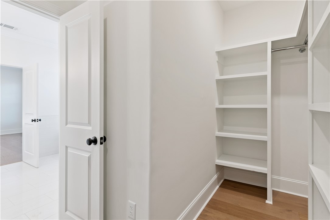 164 Old Wharf Road Brunswick, GA 31523 - Photo 34 of 44 Spacious Primary Bedroom Walk-in Closet. Photo of completed home at 174 OWR (Same General Floorplan)