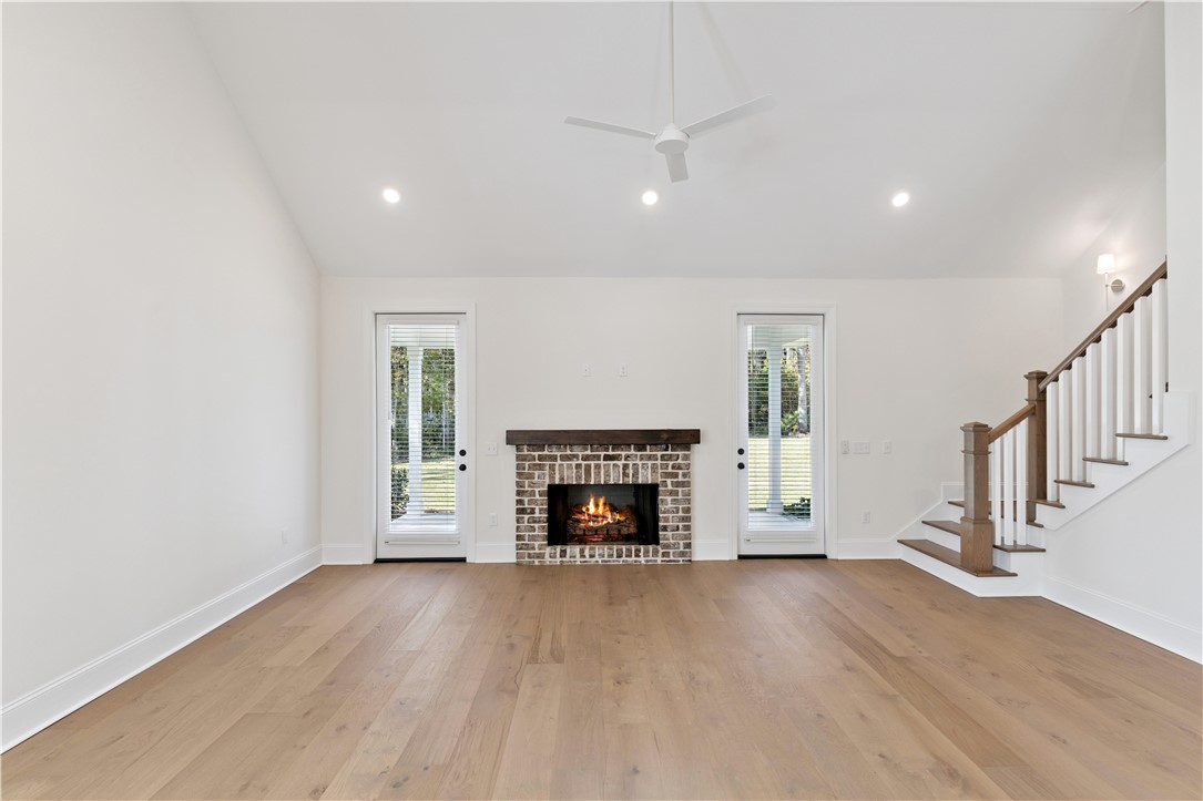 164 Old Wharf Road Brunswick, GA 31523 - Photo 18 of 44 Fireside Vaulted Great Room Leads to Covered Porch/Backyard. Photo of completed home at 174 OWR (Same General Floorplan)