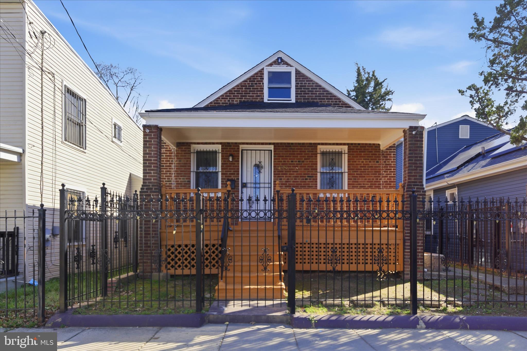 4029 Gault Place Northeast Washington, DC 20019 - Photo 1 of 33 a front view of a house with a outdoor