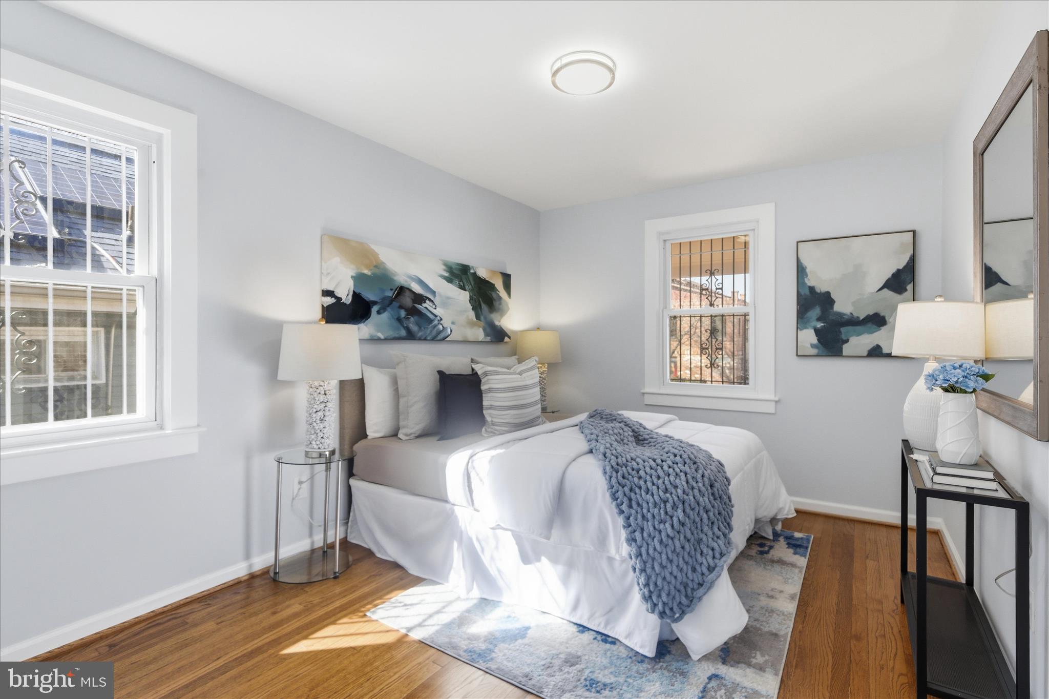 4029 Gault Place Northeast Washington, DC 20019 - Photo 11 of 33 a bedroom with a bed wooden floor and window