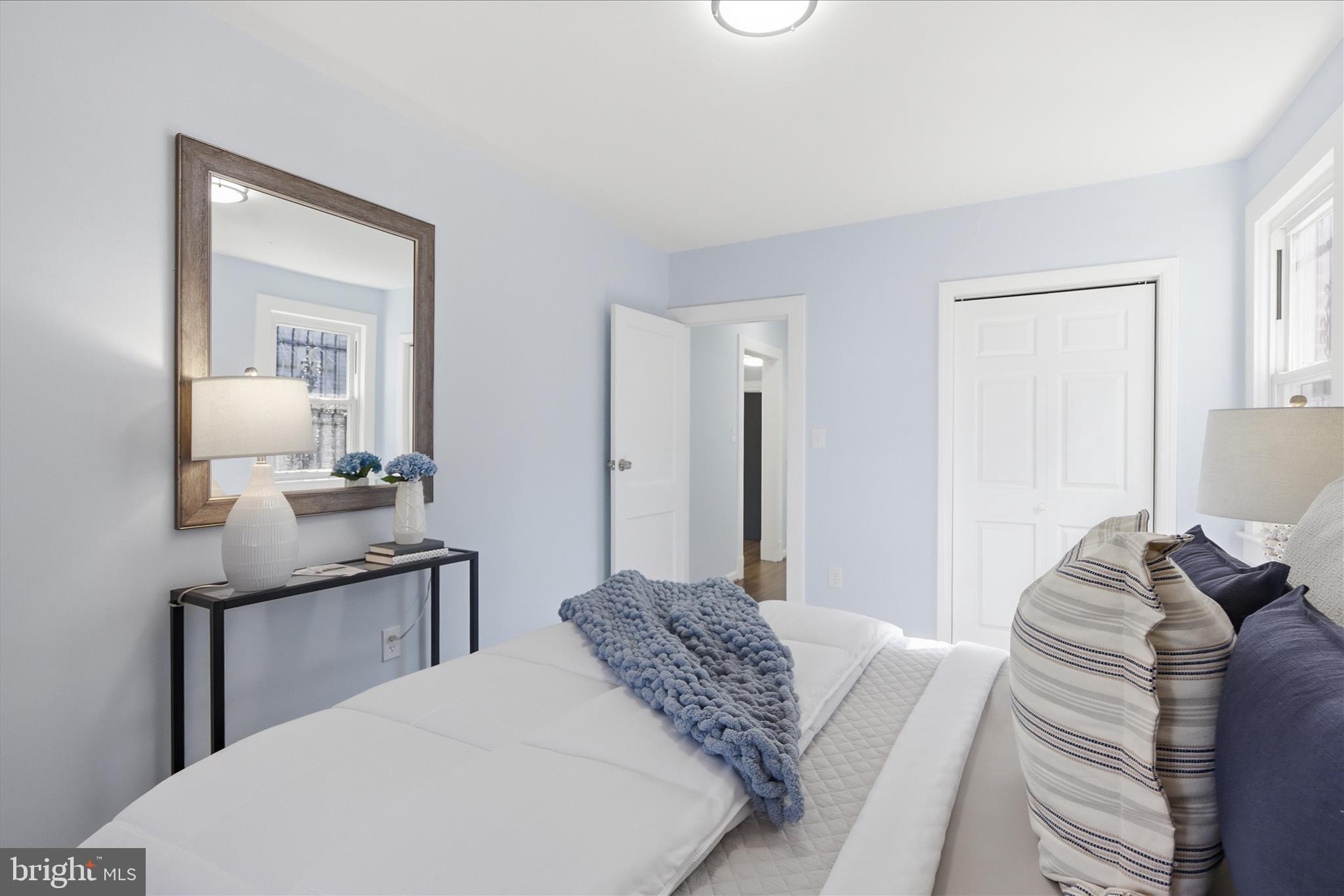 4029 Gault Place Northeast Washington, DC 20019 - Photo 13 of 33 a bedroom with a bed and a mirror