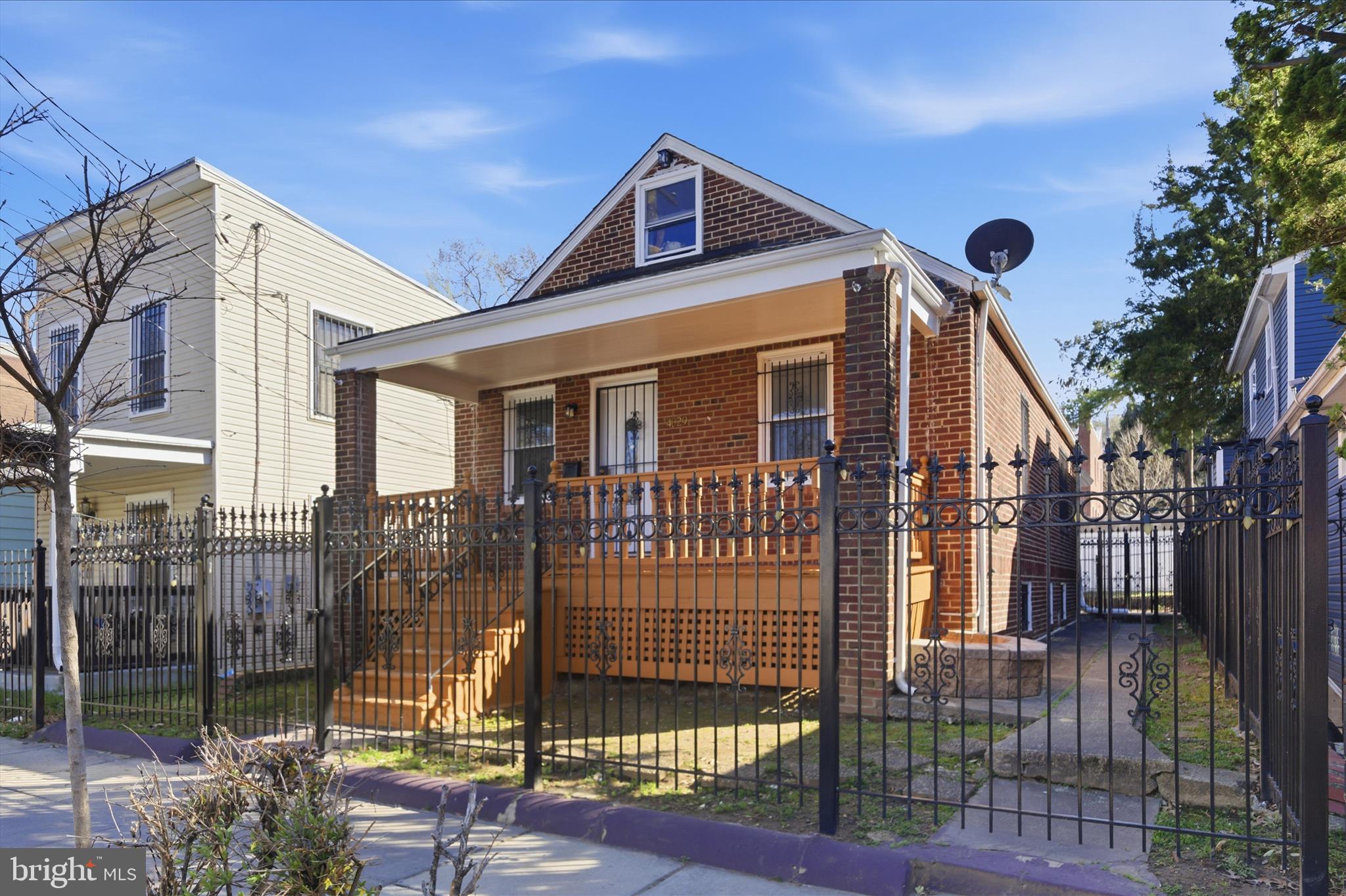 4029 Gault Place Northeast Washington, DC 20019 - Photo 2 of 33 a front view of a house with parking