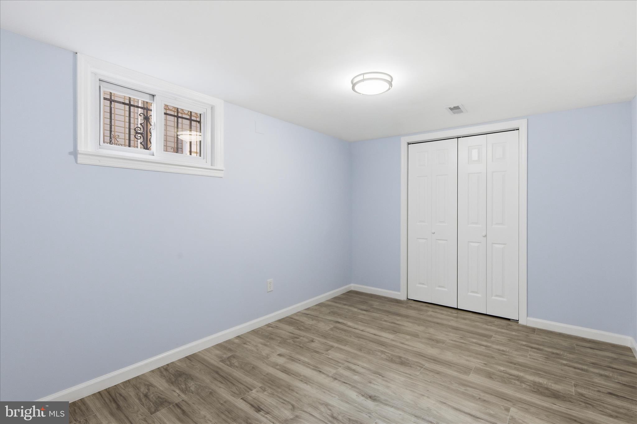 4029 Gault Place Northeast Washington, DC 20019 - Photo 21 of 33 a view of empty room with wooden floor and fan