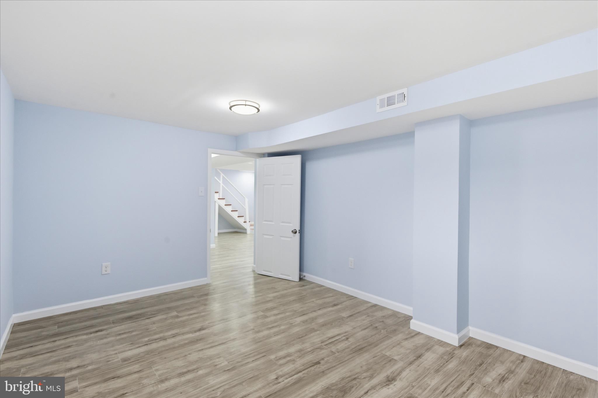 4029 Gault Place Northeast Washington, DC 20019 - Photo 24 of 33 a view of an empty room with wooden floor