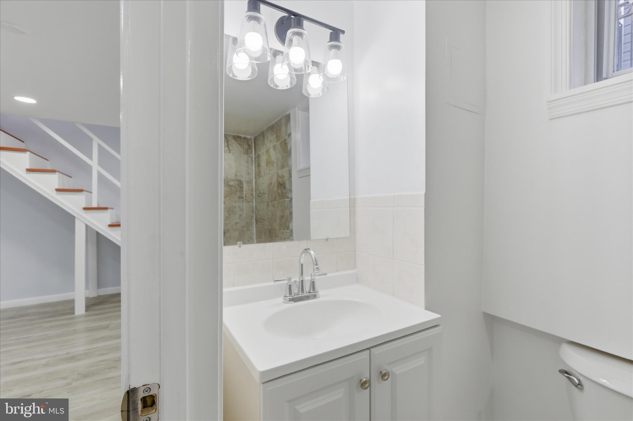 4029 Gault Place Northeast Washington, DC 20019 - Photo 25 of 33 a bathroom with a sink and a mirror