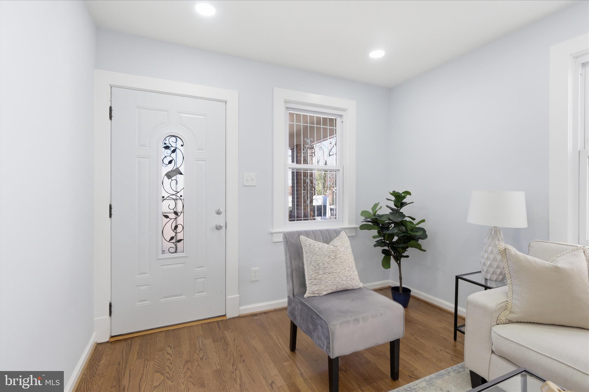 4029 Gault Place Northeast Washington, DC 20019 - Photo 5 of 33 a living room with furniture and a potted plant