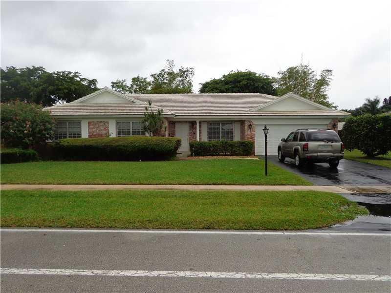 621 Southwest 75th Avenue Plantation, FL 33317 - Photo 1 of 20 a front view of a house with a garden