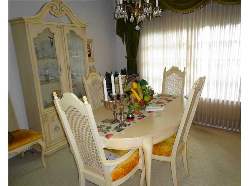 621 Southwest 75th Avenue Plantation, FL 33317 - Photo 11 of 20 a view of a dining room with furniture and a chandelier