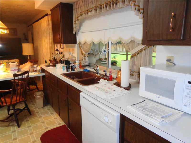 621 Southwest 75th Avenue Plantation, FL 33317 - Photo 13 of 20 a kitchen with a sink appliances and cabinets