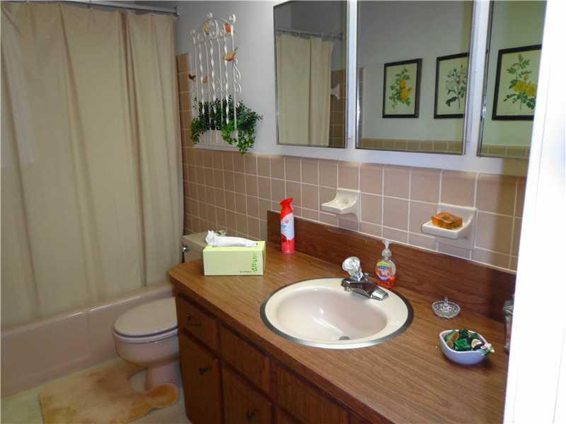 621 Southwest 75th Avenue Plantation, FL 33317 - Photo 17 of 20 a bathroom with a sink a toilet and mirror