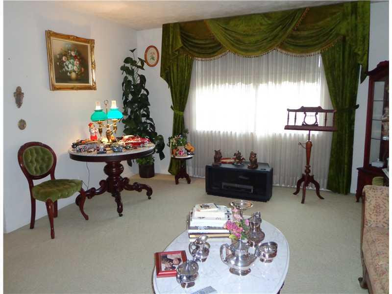 621 Southwest 75th Avenue Plantation, FL 33317 - Photo 2 of 20 a living room with furniture and a fireplace