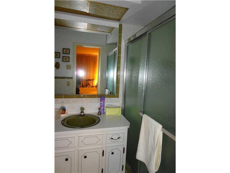 621 Southwest 75th Avenue Plantation, FL 33317 - Photo 6 of 20 a bathroom with a sink and a mirror