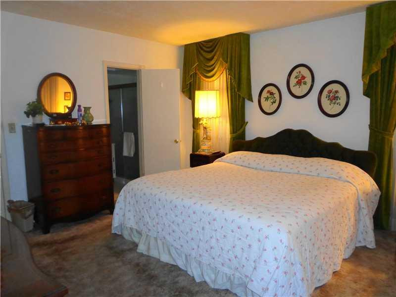 621 Southwest 75th Avenue Plantation, FL 33317 - Photo 8 of 20 a bedroom with a bed and a mirror