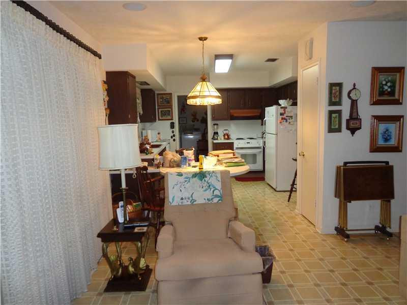621 Southwest 75th Avenue Plantation, FL 33317 - Photo 10 of 20 a dining room with furniture and a chandelier
