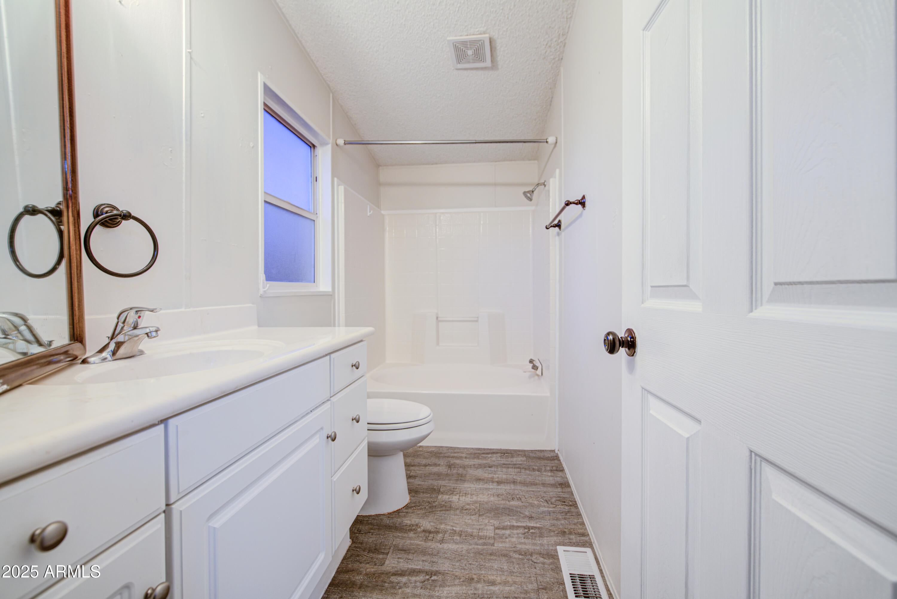 19401 North 7th Street, Unit 94 Phoenix, AZ 85024 - Photo 11 of 12 a bathroom with a granite countertop sink toilet and shower