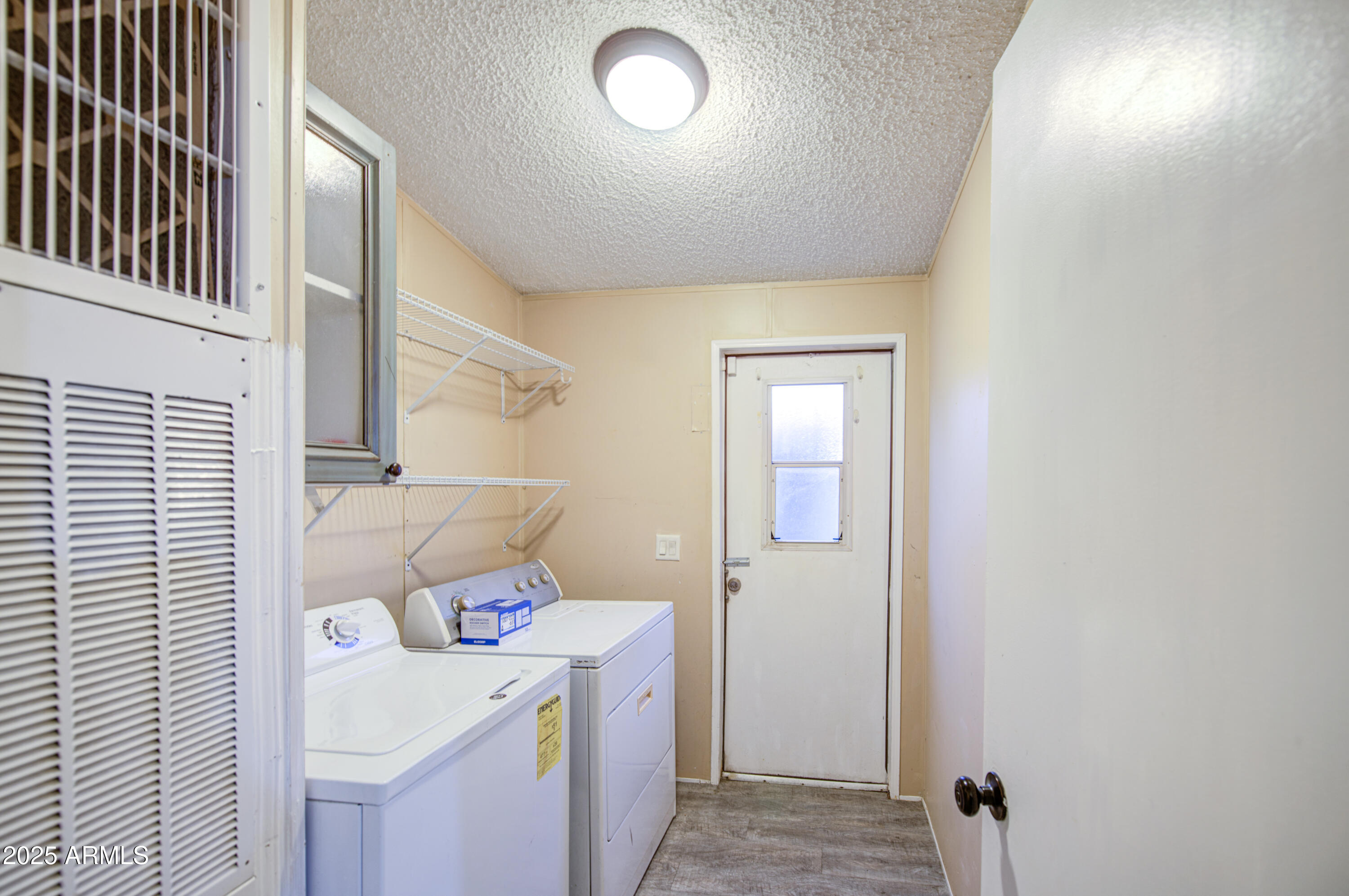 19401 North 7th Street, Unit 94 Phoenix, AZ 85024 - Photo 8 of 12 a utility room with dryer and washer
