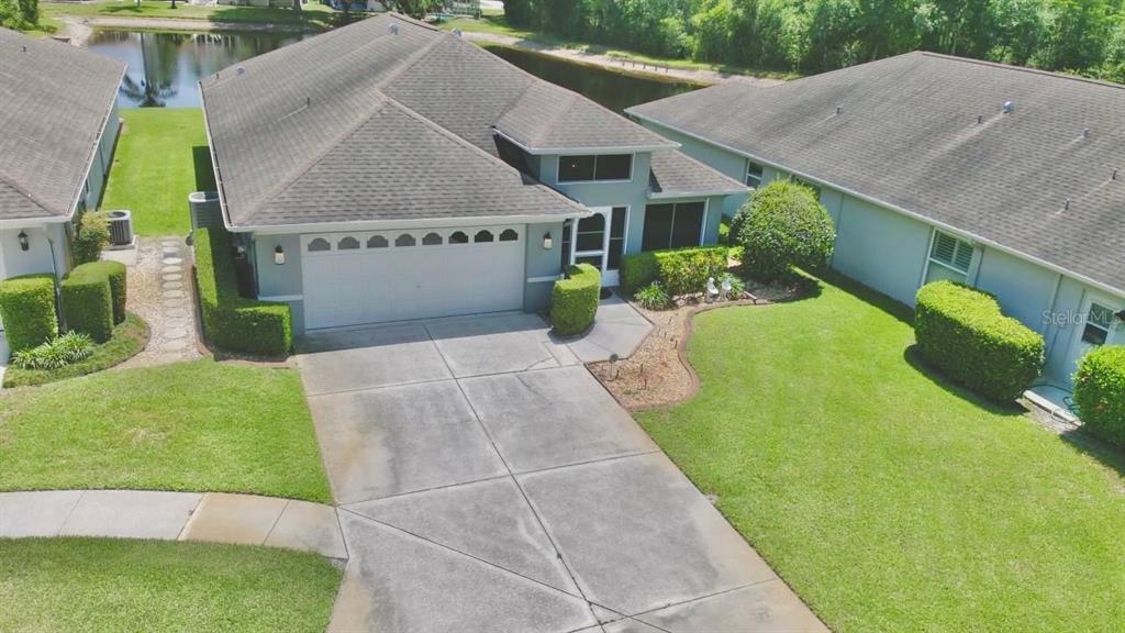 7842 Tenby Court New Port Richey, FL 34655 - Photo 25 of 27 a view of a house with a yard