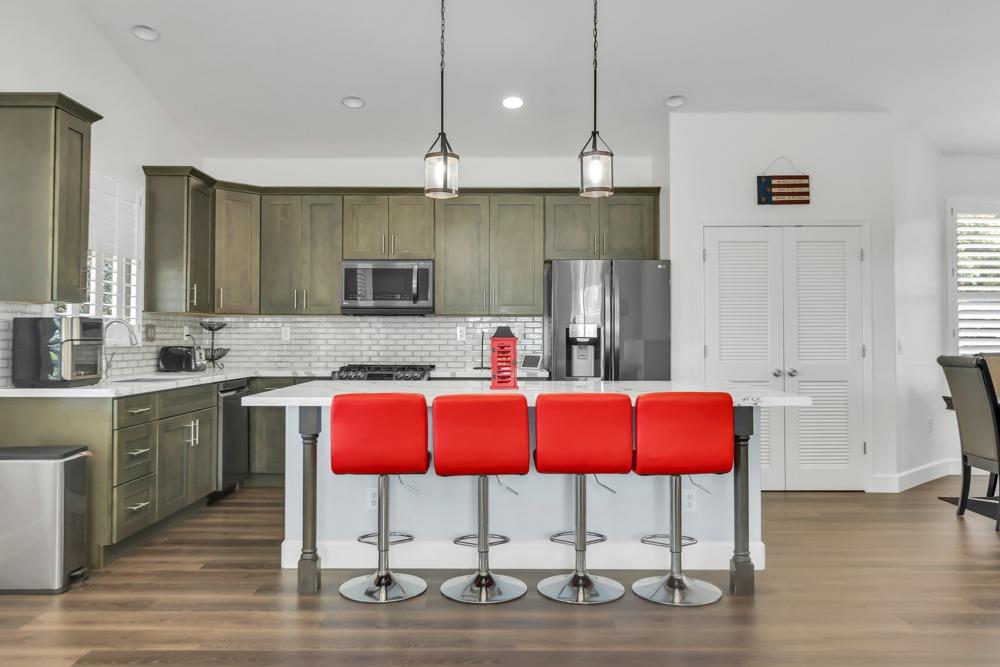 32852 South River Road Clarksburg, CA 95612 - Photo 17 of 72 a kitchen with a refrigerator cabinets and wooden floor