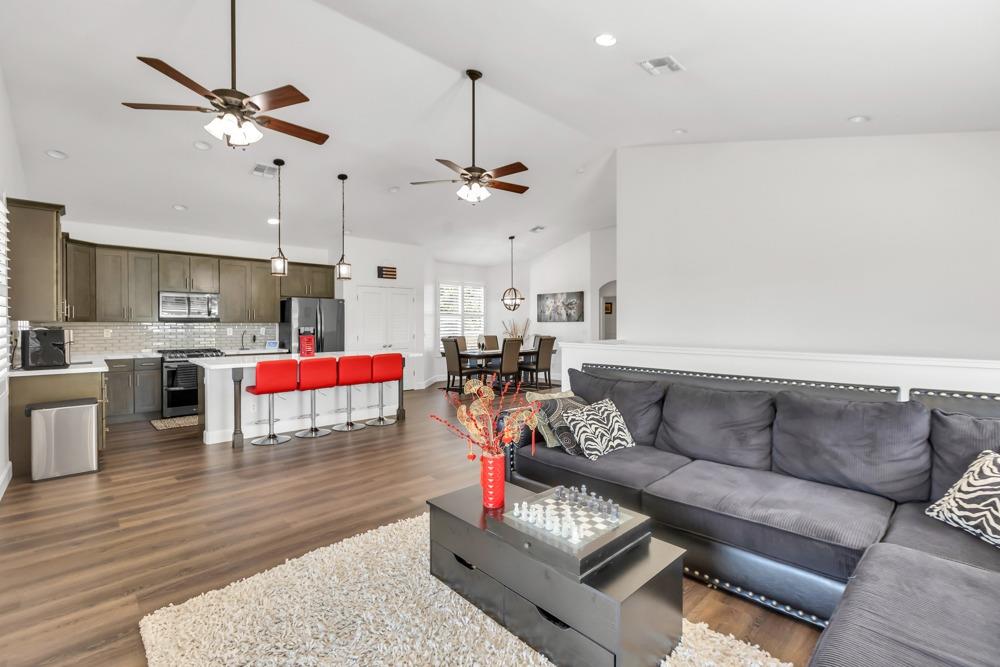 32852 South River Road Clarksburg, CA 95612 - Photo 21 of 72 a living room with furniture kitchen view and a chandelier