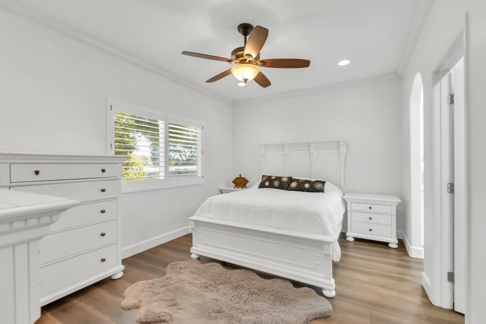 32852 South River Road Clarksburg, CA 95612 - Photo 23 of 72 a bedroom with a bed and a chandelier