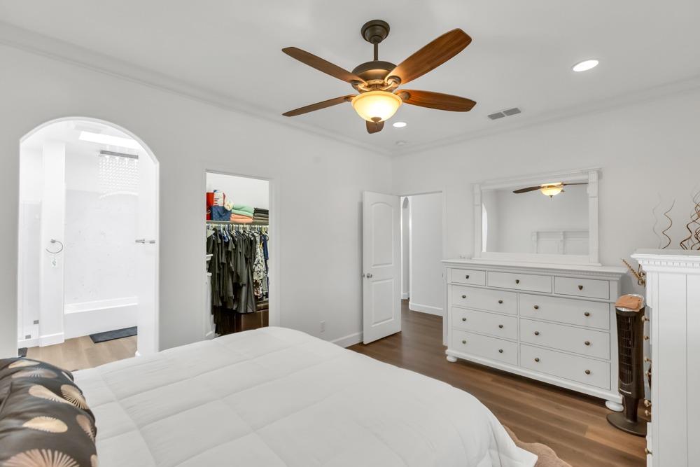 32852 South River Road Clarksburg, CA 95612 - Photo 24 of 72 a bedroom with a bed and a chandelier