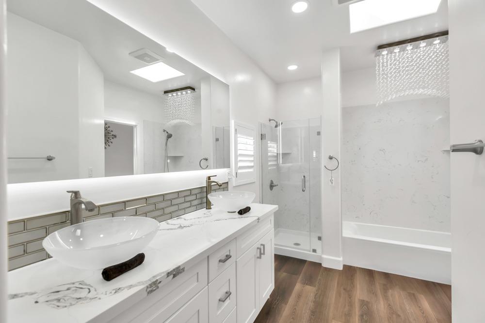32852 South River Road Clarksburg, CA 95612 - Photo 26 of 72 a bathroom with a double vanity sink mirror and shower
