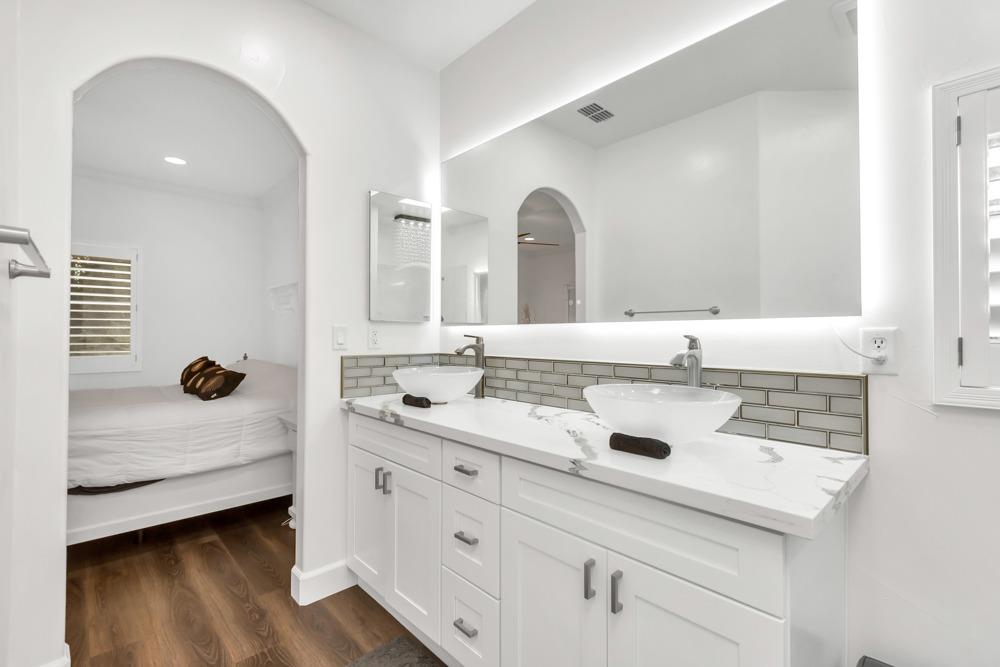 32852 South River Road Clarksburg, CA 95612 - Photo 28 of 72 a bathroom with a double vanity sink mirror and window