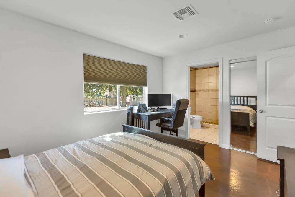 32852 South River Road Clarksburg, CA 95612 - Photo 40 of 72 a bedroom with a bed and a desk