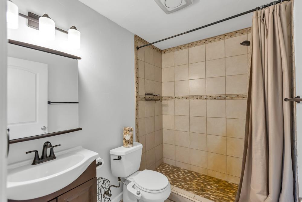 32852 South River Road Clarksburg, CA 95612 - Photo 41 of 72 a bathroom with a sink a toilet and shower