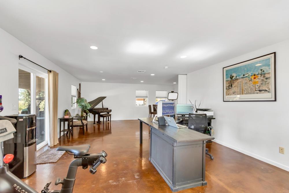32852 South River Road Clarksburg, CA 95612 - Photo 46 of 72 a living room with furniture a dining table and chairs with kitchen view