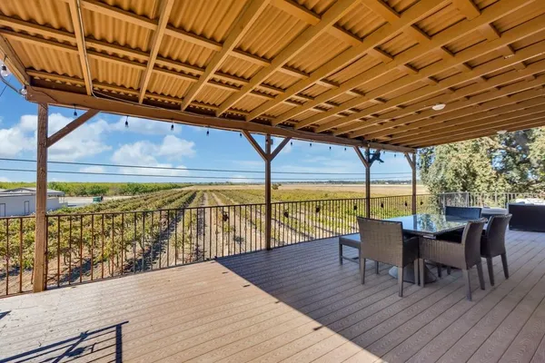 a view of a chairs and table in the patio