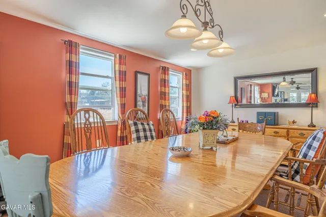 a view of a livingroom with furniture and a flat screen tv