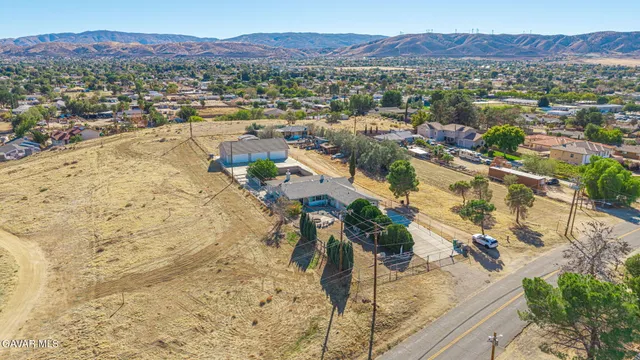 an aerial view of residential building and ocean