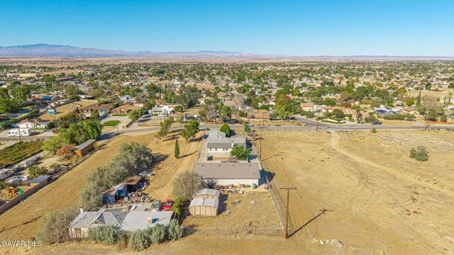 an aerial view of residential building and ocean