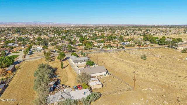 an aerial view of residential building and ocean