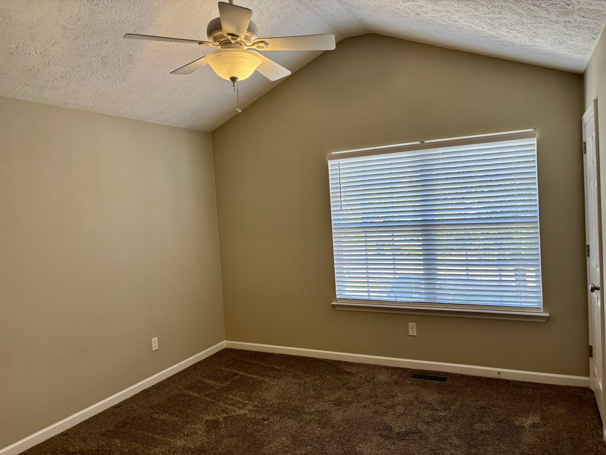 409 Compton Lane Franklin, TN 37069 - Photo 10 of 23 an empty room with a window and a ceiling fan